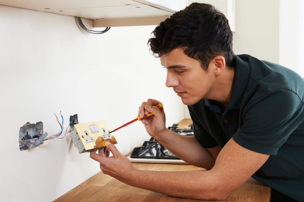 Electrician Installing Wall Socket